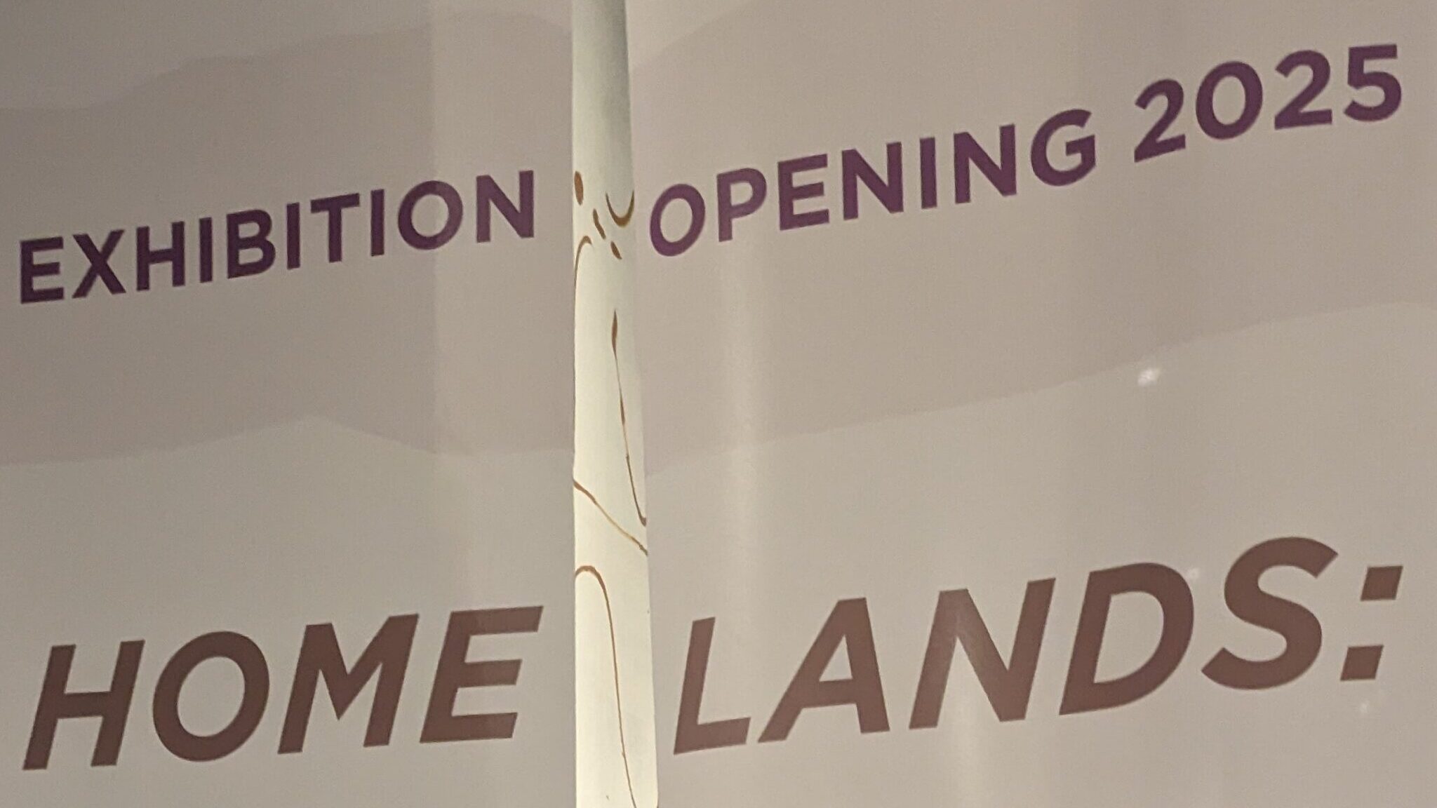 Temporary scrims at the McClung Museum reading: Exhibition Opening 2025 Homelands: